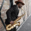 medium-shot-young-man-playing-saxophone