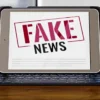 front-view-laptop-desk-with-fake-news_0