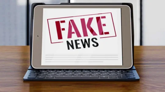 front-view-laptop-desk-with-fake-news_0