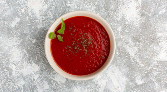 top-view-delicious-tomato-soup-with-seasonings-grey-table-soup-meal-dinner-vegetable