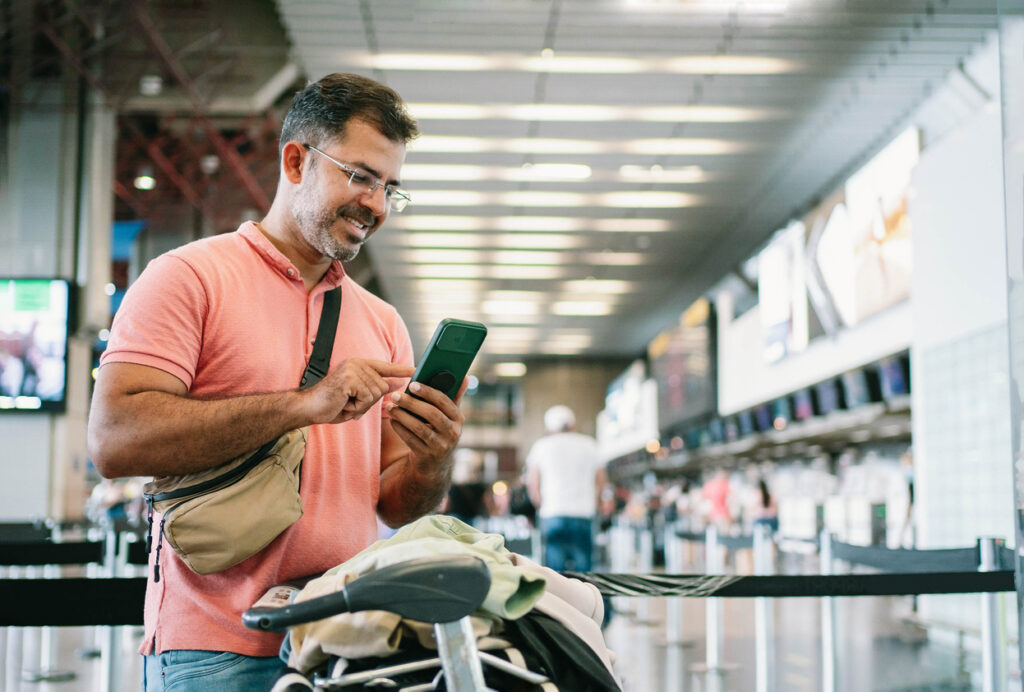 Mature man at airport waiting for check in