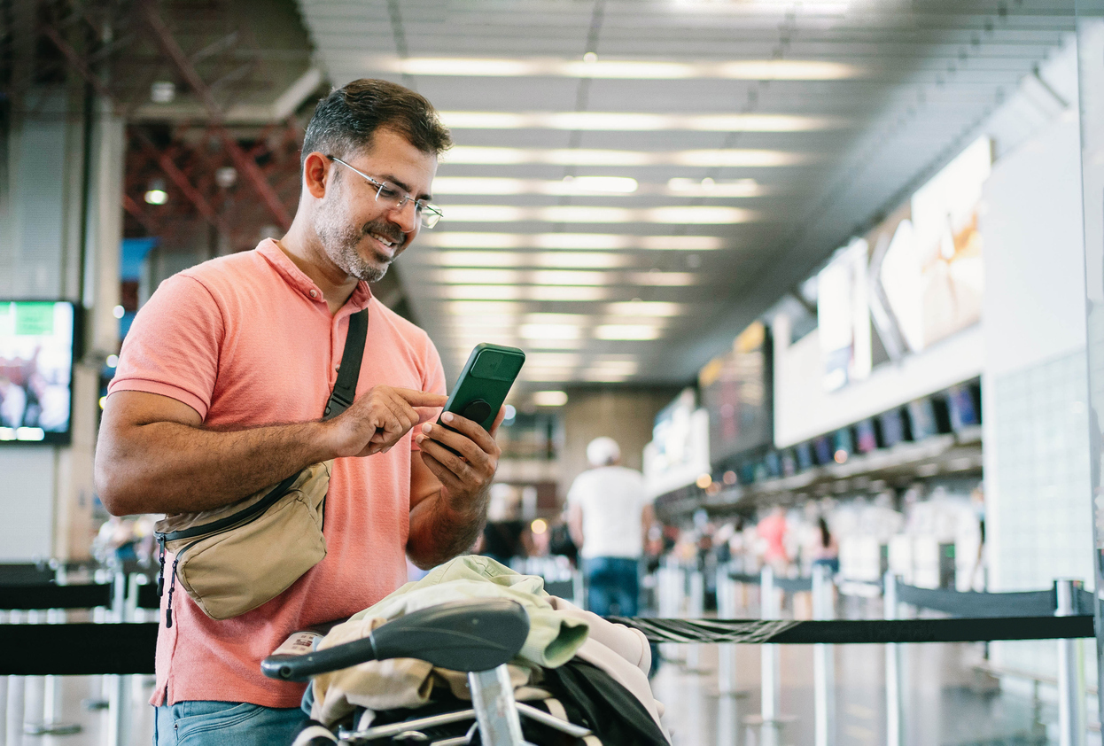 Mature man at airport waiting for check in