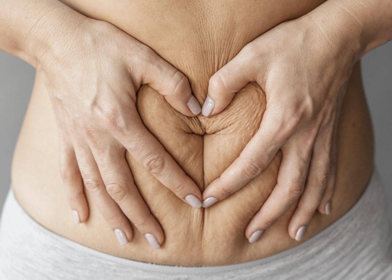 close-up-hands-holding-belly (1)