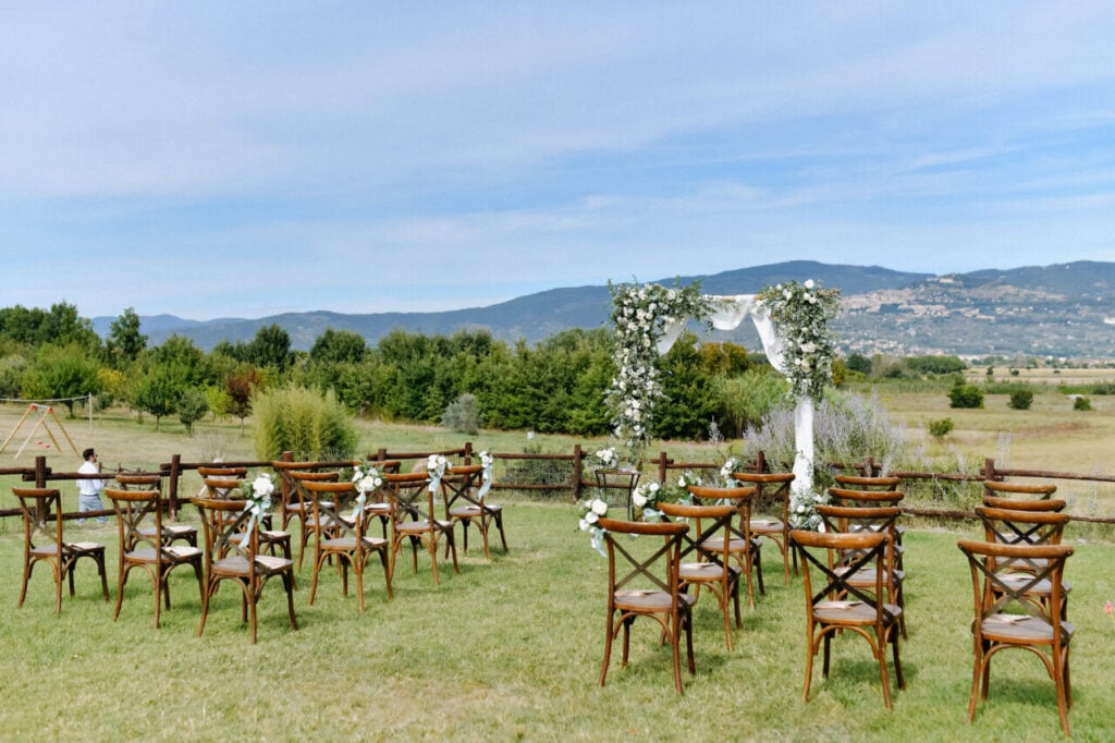 Ceremonial wedding archway and chiavari chairs  for guests outdo