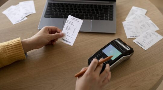 close-up-hand-holding-receipt