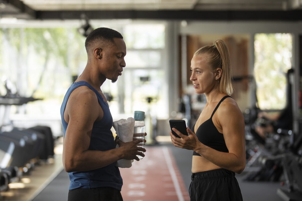 side-view-people-chatting-gym