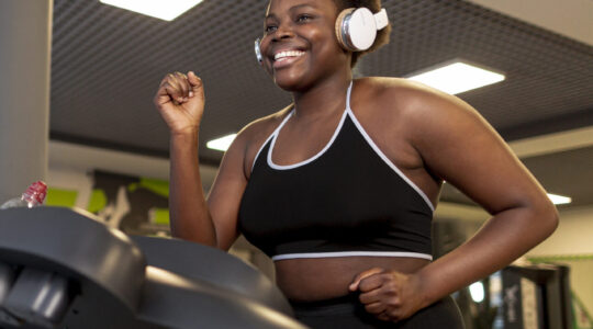 low-angle-smiley-female-running-treadmill