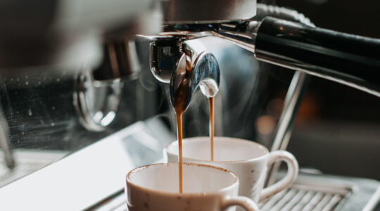 two espresso cups under coffee engine