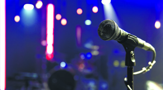 Close up microphone on blurred background with bokeh.