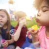 close-up-happy-kids-playing-with-soap-bubbles.jpg