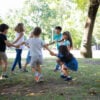 Happy children playing together outdoors