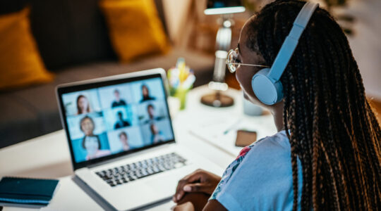 Group of unrecognisable international students having online meeting