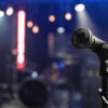 Close up microphone on blurred background with bokeh.
