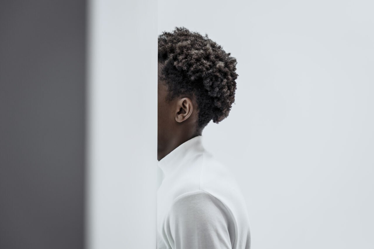 Man in a minimal white interior smart home