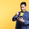 Happy gamer celebrating after winning game on gaming console
