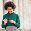 Business woman using her mobile phone outdoors.
