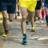 legs running athletes on a forest trail