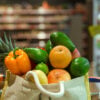 Eco bag with different fruits and vegetables. Shopping in the supermarket.