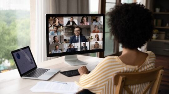 African American distant worker meeting, negotiating with office team