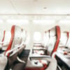 Abstract blur and defocused passenger seat interior of airplane